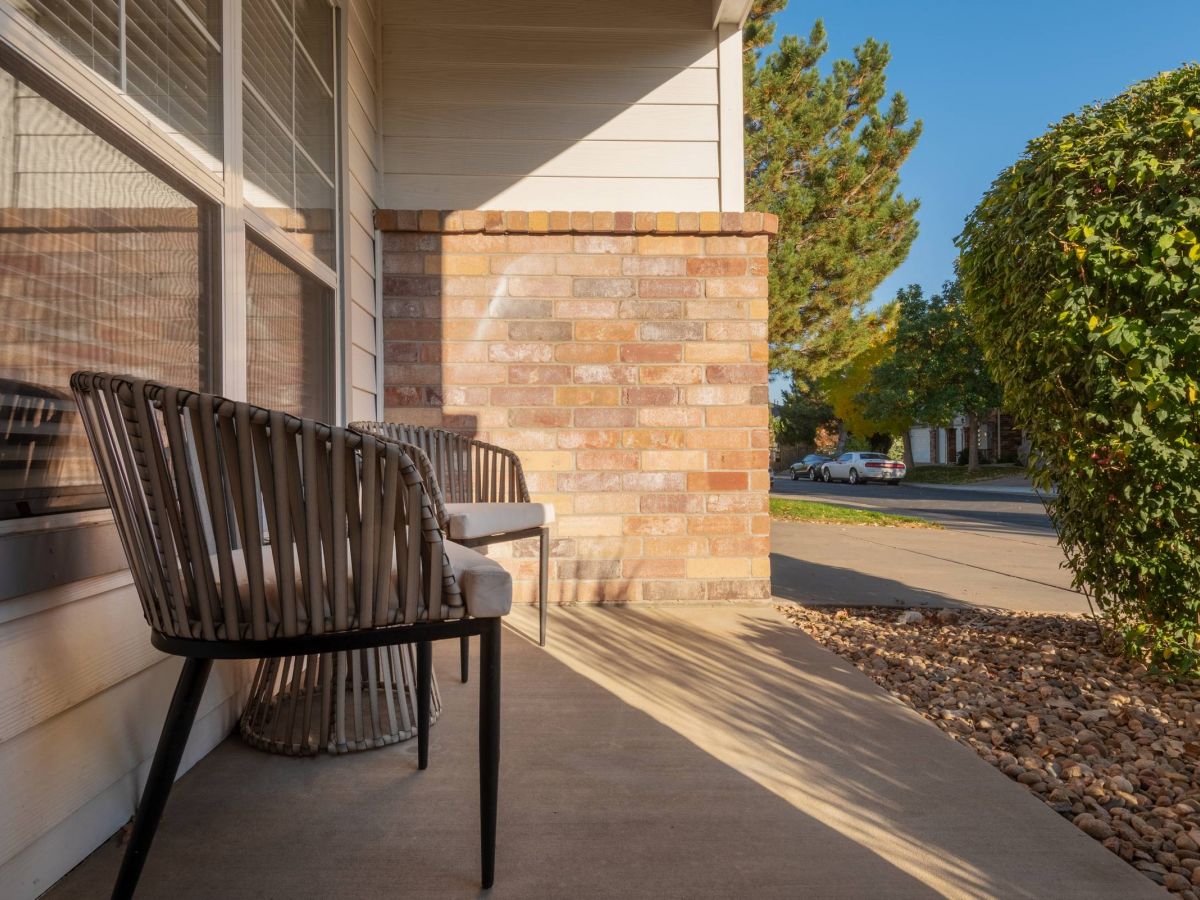 The Windsor resident porch with lounge chairs