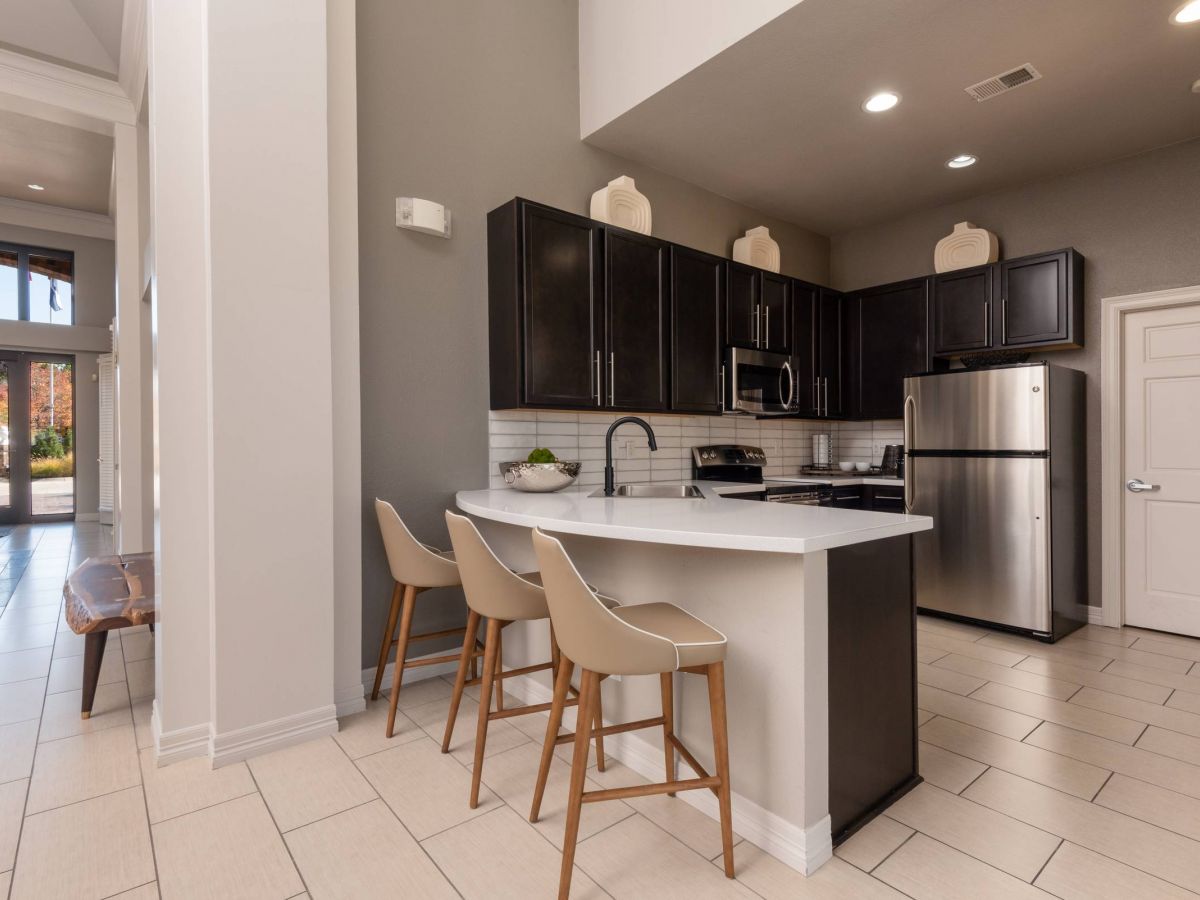 The Windsor community kitchen area with large kitchen island and stools
