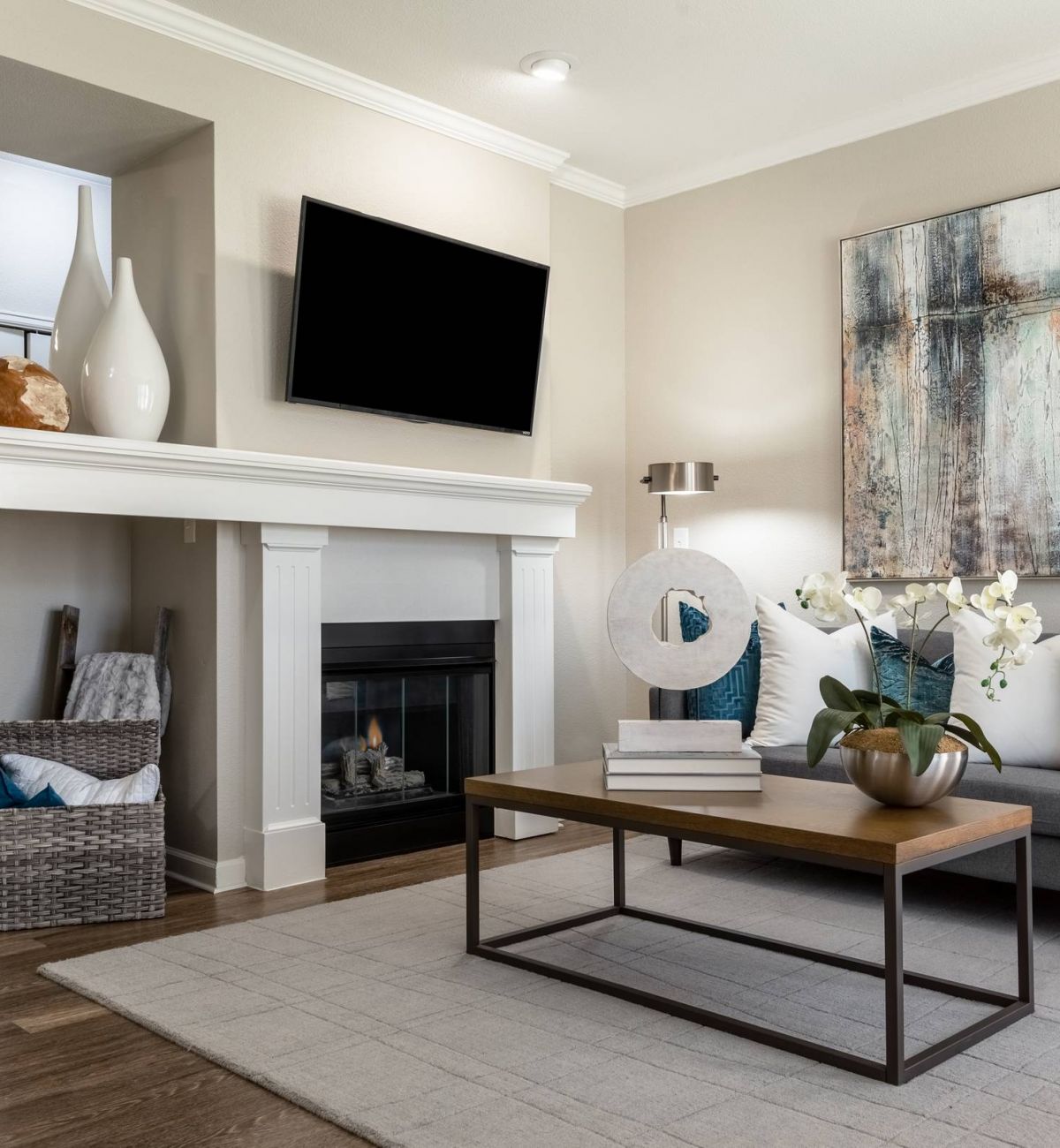 Brixton at Bear Creek living room with fireplace and large tv furnished with couch and coffee table