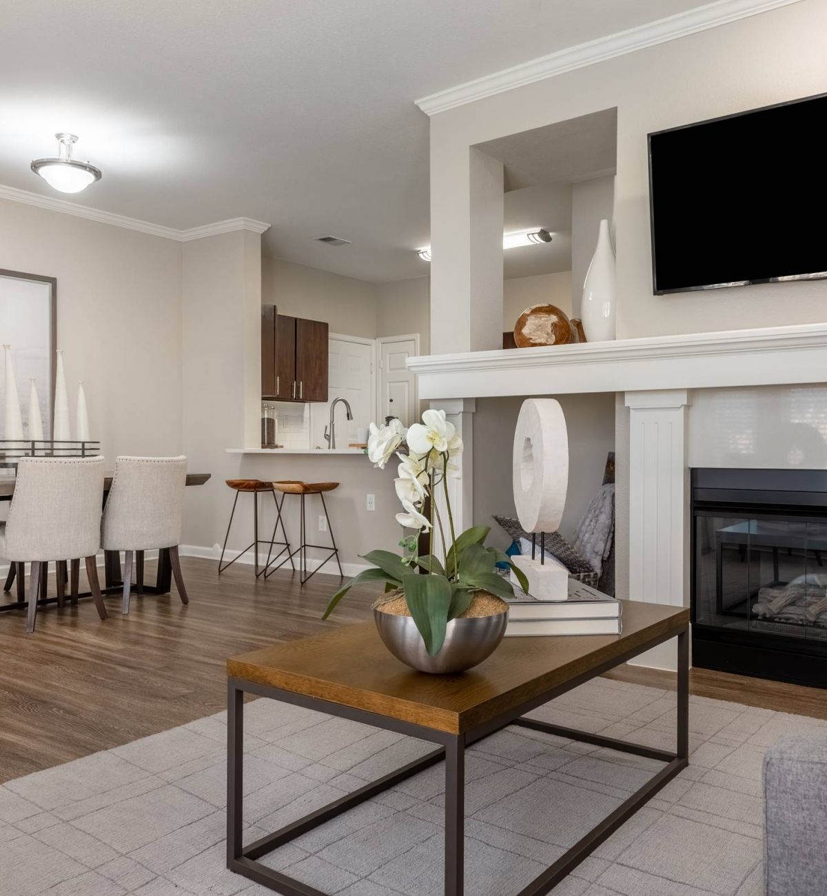 Brixton at Bear Creek living space interior with fireplace and coffee table featuring open floor plan